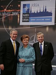 President George W. Bush stands with President Vaira Vike-Freiberga of Latvia, and NATO Secretary General Jaap de Hoop Scheffer