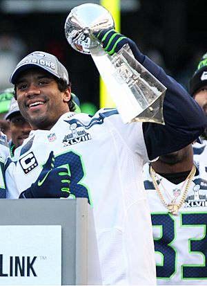 Russell Wilson with Lombardi Trophy