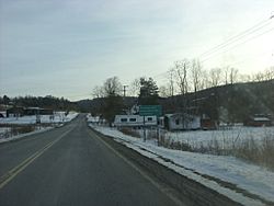 County Route 115 at the intersection with the Old 76 Road in Guide Board Corners. Before 1980, this was the southern terminus of NY 330