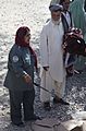 Afghan Uniformed Police officer Noor Haya talks with an elder outside the district center in Spin Boldak, Kandahar province, Afghanistan, Sept 110918-A-VB845-368
