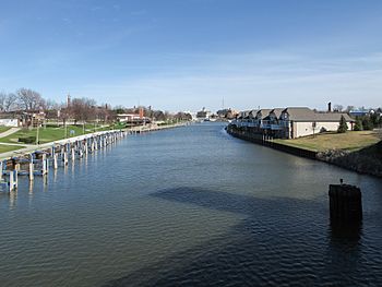 A color photograph of the Black River as viewed from a bridge in Port Huron, Michigan