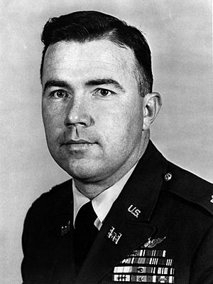 A monochrome image of a man in a military dress uniform. He is facing the camera and turned slightly to the left.