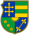 A coat of arms depicting stripes, a double cross, roses and sun