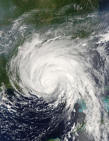 A view of Hurricane Dennis from Space on July 10, 2005. The storm's small eye is visible at the center of the image. Dennis is located south of Pensacola, Florida, in the Gulf of Mexico. The western tip of Cuba is seen on the right side of the image.