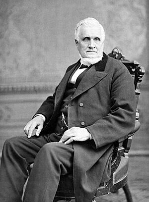 John Taylor seated in chair