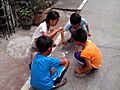Kids playing pog