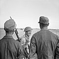 A British soldier gives a V-for-Victory sign to German prisoners captured at El Alamein, 26 October 1942. E18522