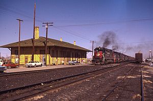 An SP westbound passing the old Demong NM depot. (9186465099)