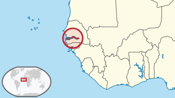 Location of the Gambia (dark red area within circle) on the coast of West Africa.