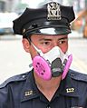 Police officer wearing half-mask respirator