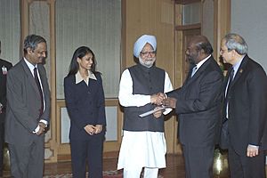 Shri Shiv Nadar and Ms Roshni Nadar presenting a cheque of Rs. 4 crore to the Prime Minister, Dr. Manmohan Singh, towards the Prime Minister's National Relief Fund in New Delhi on January 17, 2005
