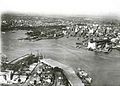 Aerial view of Sydney Harbour - the bridge is under construction