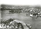 Aerial view of Sydney Harbour - the bridge is under construction
