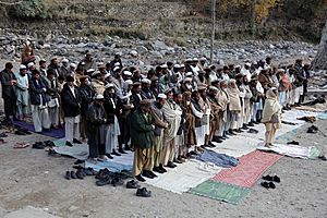 Afghan men praying in Kunar-2009