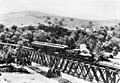 Los Angeles and San Gabriel Railroad train on the bridge at Garvanza, the first trestle across the Arroyo Seco, approaching Highland Park from South Pasadena, ca.1885 (CHS-6666)