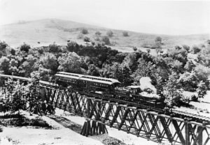Los Angeles and San Gabriel Railroad train on the bridge at Garvanza, the first trestle across the Arroyo Seco, approaching Highland Park from South Pasadena, ca.1885 (CHS-6666)