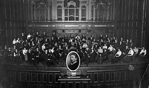 NEC Symphony Orchestra, 1915 with George Whitefield Chadwick (inset)