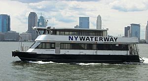 NY Waterway ferry with Jersey City skyline.jpg