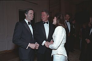 President Bill Clinton and First Lady Hillary Clinton greet guests at the National Governors Association Dinner in the Blue Room of the White House (18) (cropped)