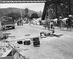 Royal Engineers prepare to blow up a bridge in Malaya
