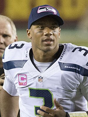 Russell Wilson postgame vs Washington 2014 (cropped)