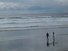 Surfers on the beach of Ucluelet
