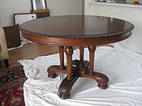 “Circular Dining Table, by Francis de Groot, with four (not three) column supports and shaped base with acanthus carving, diameter 4 feet (1.2192 metres)”