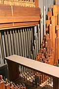 view of the chimes and several of the ranks of wooden and metal pipes inside one of the upper swell box inside the organ.