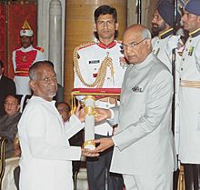 He President, Shri Ram Nath Kovind presenting the Padma Vibhushan Award to Shri Illaiyaraja