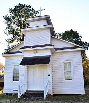 Small white clapboard church.