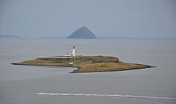 Pladda seen from the Isle of Arran, with Ailsa Craig in the background