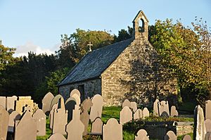 A small, almost windowless single-story church in a graveyard.