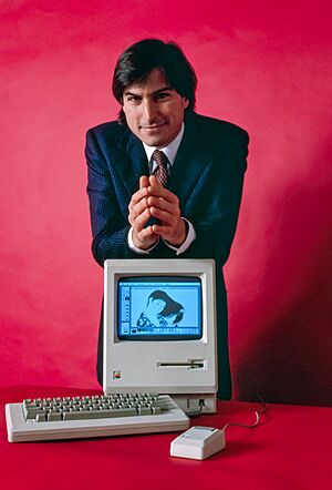 Steve Jobs and Macintosh computer, January 1984, by Bernard Gotfryd - edited 2