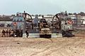 US Marines and their equipment loaded on board the LCAC is sitting alongside the runway at the airport of Mogadishu