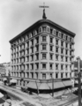 W. E. Cummings store in Grant Block, NW corner 4th and Broadway, shortly after Grant Building was enlarged to 7 stories in 1902