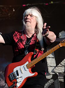 Andy Scott on stage with guitar
