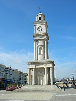 Tall clock tower with classical columns