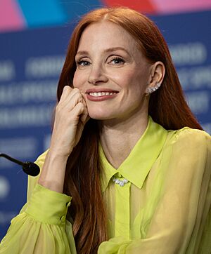 Chastain smiling at the camera