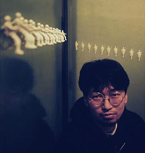 Artist Takashi Murakami with early works at Galerie Mars in Tokyo 1992. Photographed by Ithaka Darin Pappas A
