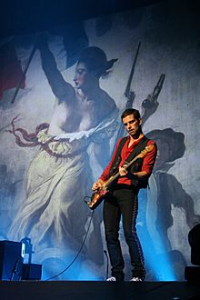 Guy Berryman playing the bass in 2008.