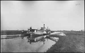 Photograph with caption "Steamer 'Marion' with 'Rambler' in tow at Aqueduct 4. Sept. 24, 1908." - NARA - 282345