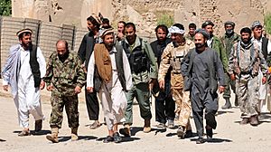 Taliban insurgents turn themselves in to Afghan National Security Forces at a forward operating base in Puza-i-Eshan -a