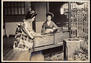 Two Women rinse the hands (act of misogi using temizu) (1915-04 by Elstner Hilton)