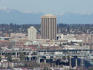 The U-District, looking northeast from Queen Anne. UW Tower is the tall building in the center, with the Hotel Deca (originally the Meany Hotel) to its left. The I-5 Ship Canal Bridge is in the foreground.