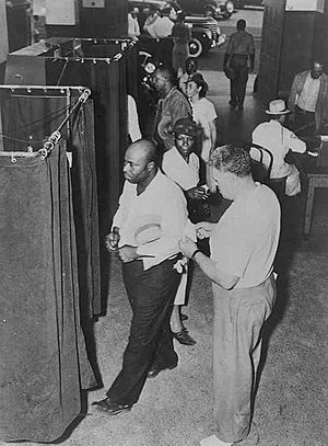 Voters at the voting booths in 1945
