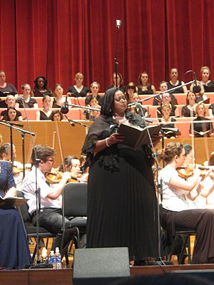 African American singer performing with orchestral accompaniment