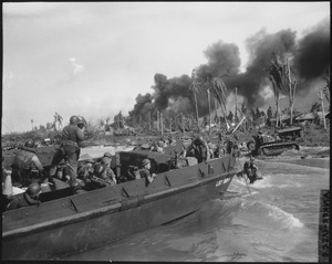 Australian troops storm ashore in the first assault wave to hit Balikpapan on the southeast coast of oil-rich Borneo.... - NARA - 513227
