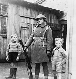 British Army soldier with local children, Torshavn, Faroe Islands