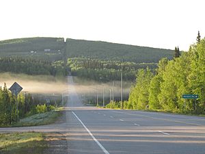 Chena Hot Springs Road runs through the CDP for 11.6 miles (18.7 km), from its intersection with the Steese Expressway to its crossing of the Little Chena River. This view looks eastbound at the intersection of CHSR with Nordale Road.