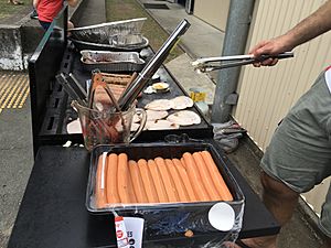 Democracy sausages being barbecued at Kenmore State School in the electoral district of Moggill at the 2017 Queensland state election